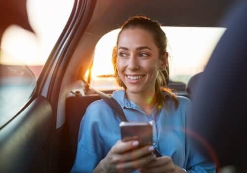 A happy woman after finding an affordable Cab Company Near You