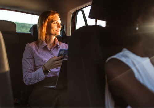A woman rides in the back of a cab from Curt's Transportation Services, a reliable Cab Company in Washington IL